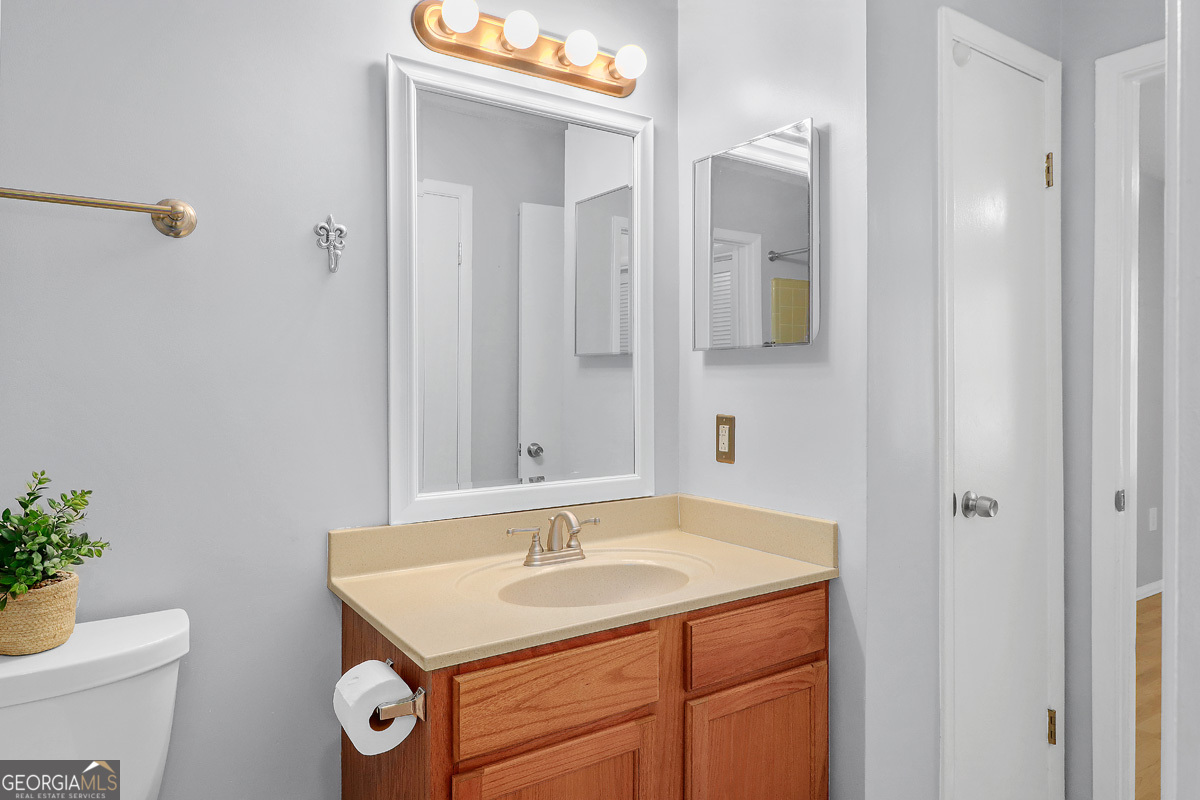 401 North Cromwell Road, Unit 2Q Savannah, GA 31410 - Photo 22 of 35 a bathroom with a sink and a mirror