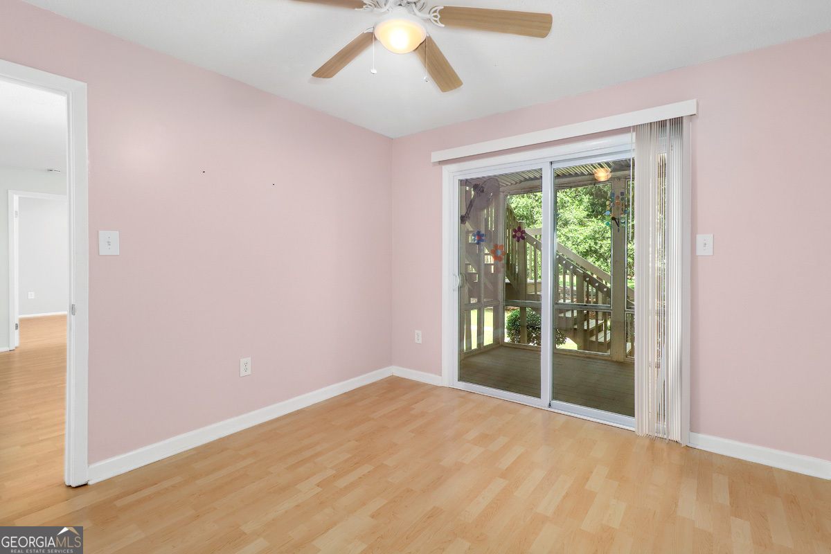 401 North Cromwell Road, Unit 2Q Savannah, GA 31410 - Photo 26 of 35 an empty room with large windows