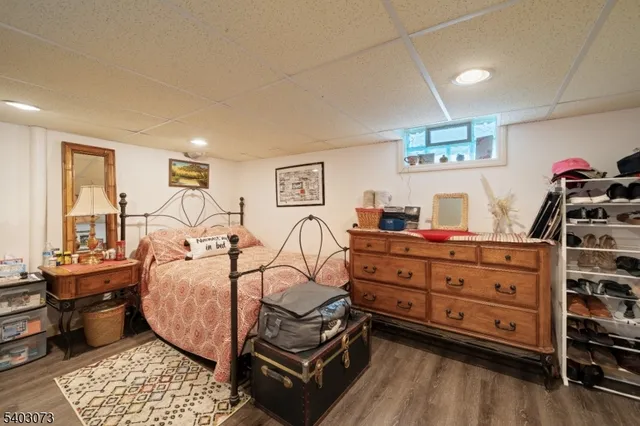 a bed room with a bed and a dresser