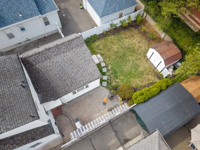 an aerial view of house with yard