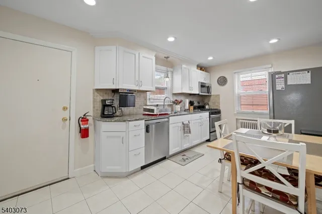 a kitchen with a sink cabinets and window