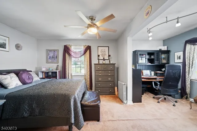 a bedroom with a bed and furniture