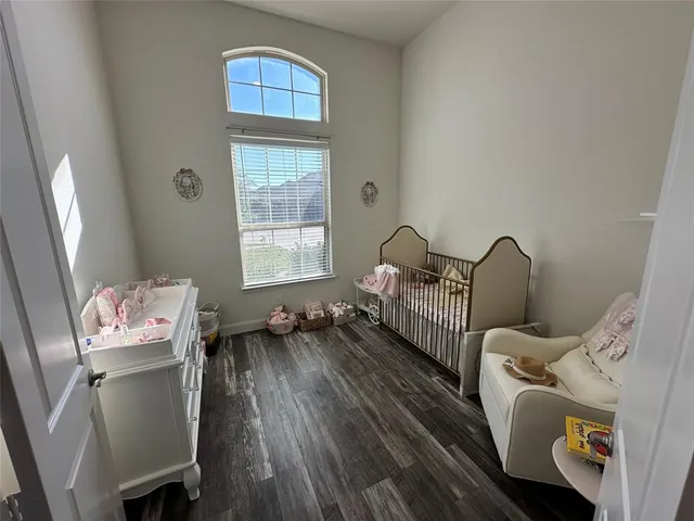 a view of entryway livingroom and hall with wooden floor