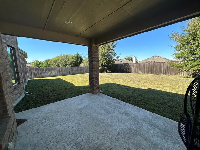 a view of bathroom with a sink and mirror