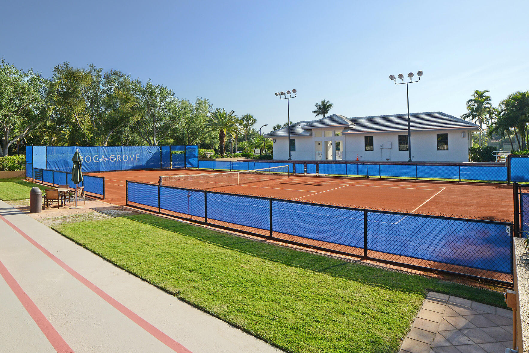 7150 Mallorca Crescent Boca Raton, FL 33433 - Photo 50 of 51 Red clay tennis court at Boca Grove