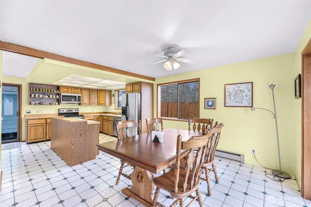 a dining room with furniture and window