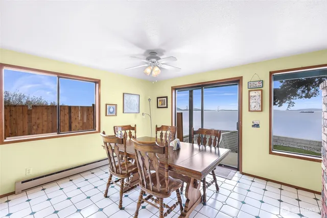 a dining room with furniture and window