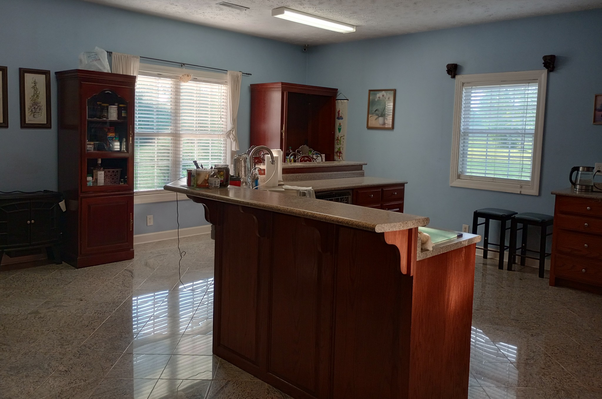 4389 Veals Road Murfreesboro, TN 37127 - Photo 3 of 8 a kitchen with stainless steel appliances granite countertop a coffee maker a sink and a refrigerator