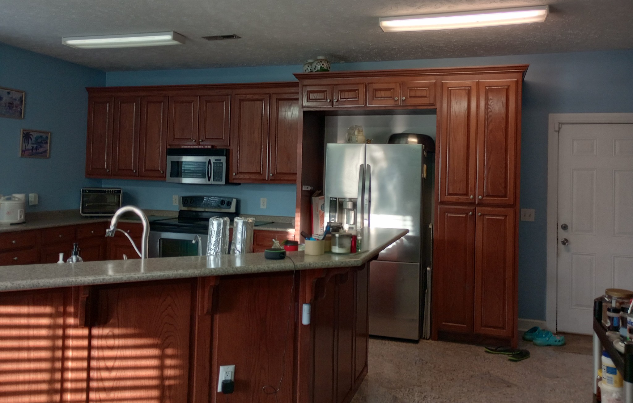 4389 Veals Road Murfreesboro, TN 37127 - Photo 4 of 8 a kitchen with stainless steel appliances granite countertop a refrigerator a stove a sink and dishwasher