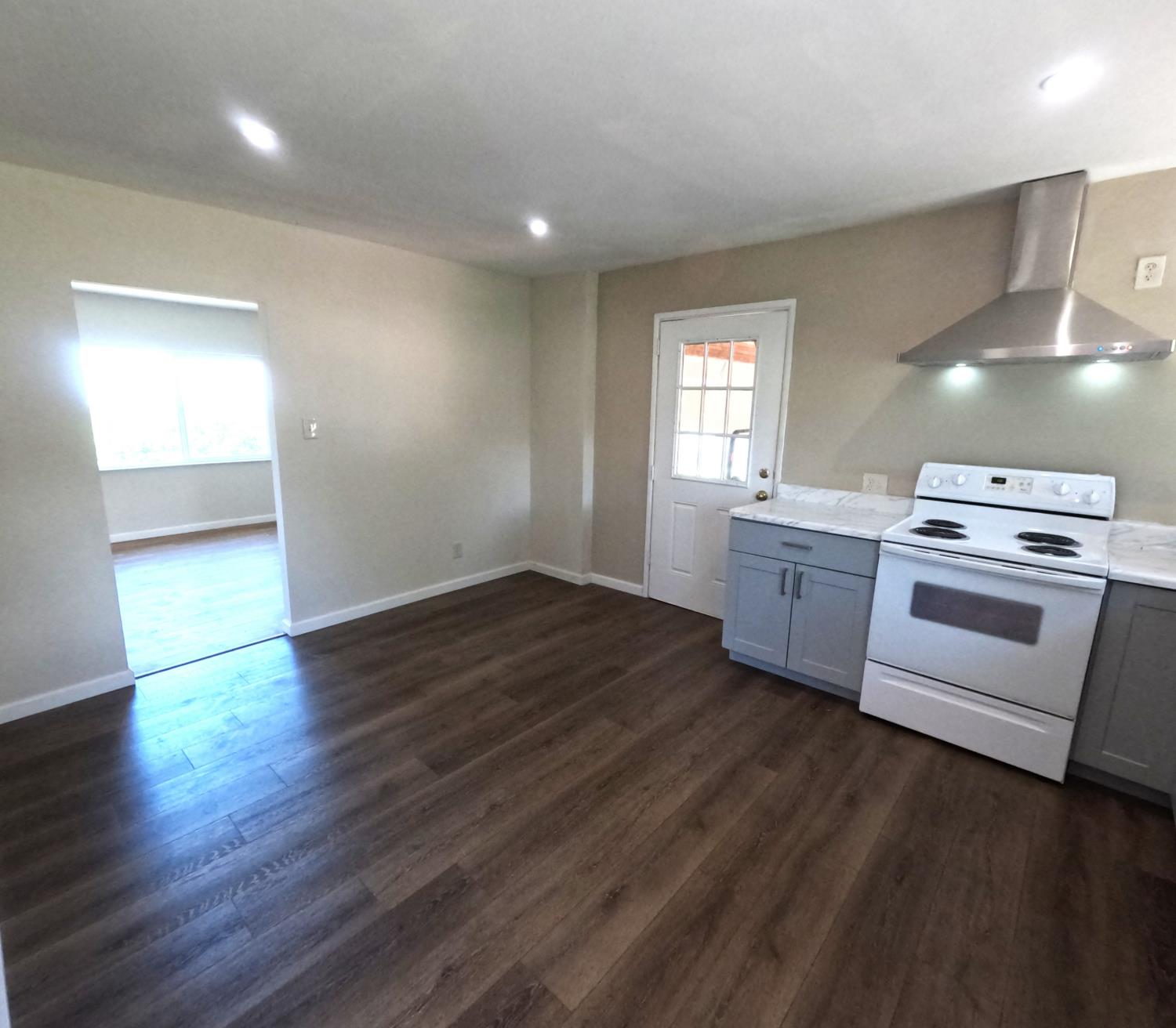 21665 Manton School Road Manton, CA 96059 - Photo 23 of 30 a kitchen with granite countertop a stove a sink and a refrigerator