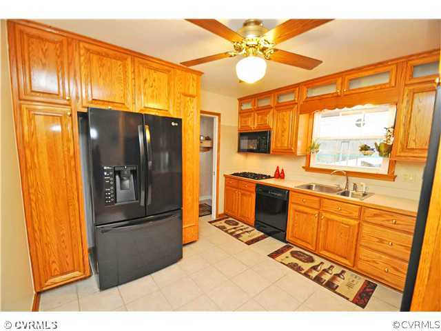 11600 Winterpock Road Chesterfield, VA 23838 - Photo 4 of 10 a kitchen with stainless steel appliances granite countertop a refrigerator a stove a sink and dishwasher
