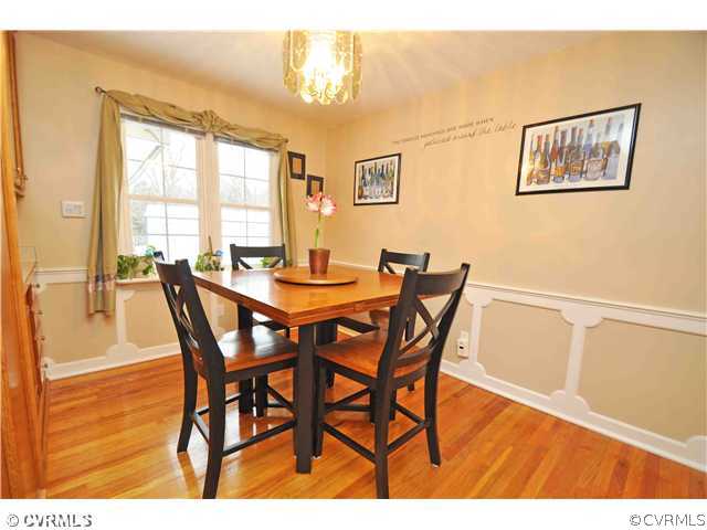11600 Winterpock Road Chesterfield, VA 23838 - Photo 5 of 10 a view of a dining room with furniture and wooden floor