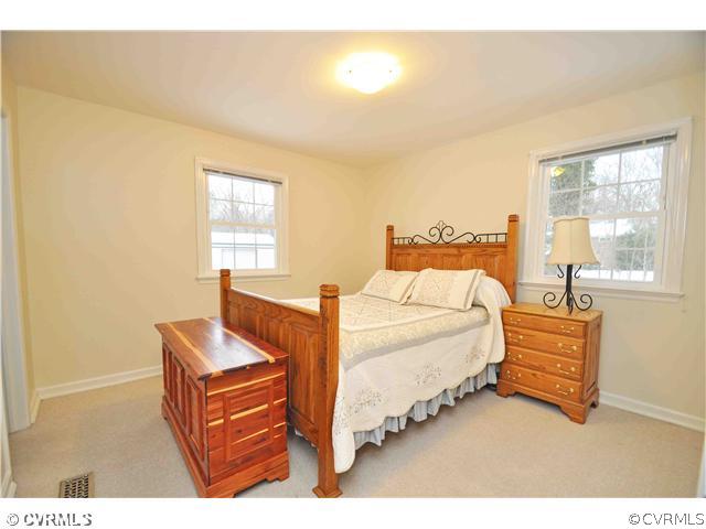 11600 Winterpock Road Chesterfield, VA 23838 - Photo 8 of 10 a bedroom with a bed and window