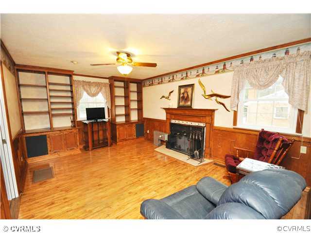 11600 Winterpock Road Chesterfield, VA 23838 - Photo 10 of 10 a living room with furniture and a fireplace