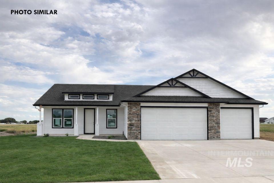 1652 Haystack Road Emmett, ID 83617 - Photo 1 of 29 Contemporary single-story residence featuring a white exterior, black-framed windows, and a black shingle roof