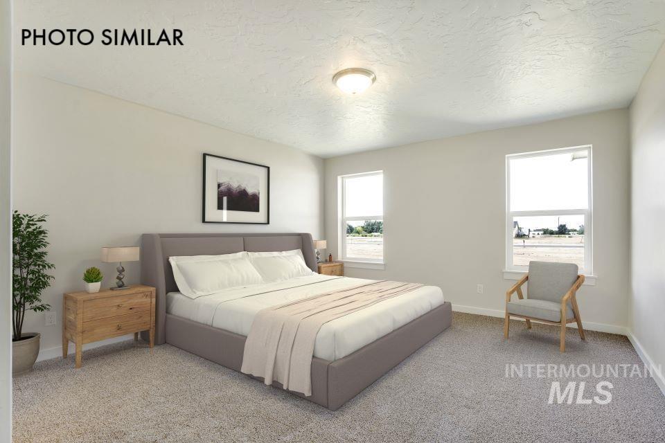 1652 Haystack Road Emmett, ID 83617 - Photo 15 of 29 Carpeted room featuring light neutral wall paint and two windows with white trim