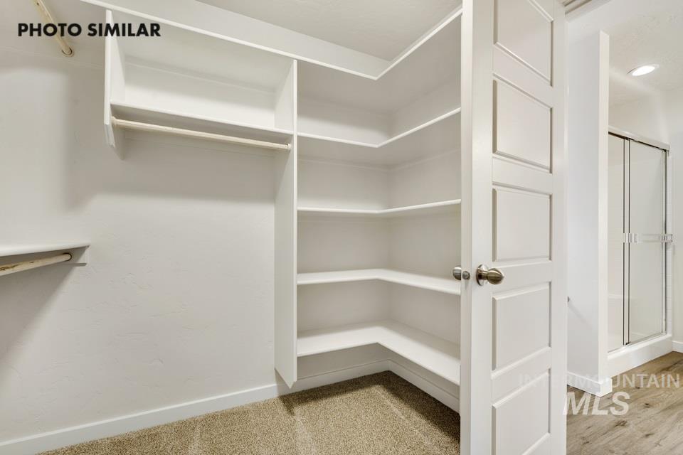 1652 Haystack Road Emmett, ID 83617 - Photo 19 of 29 Walk-in closet featuring extensive built-in shelving and hanging rods