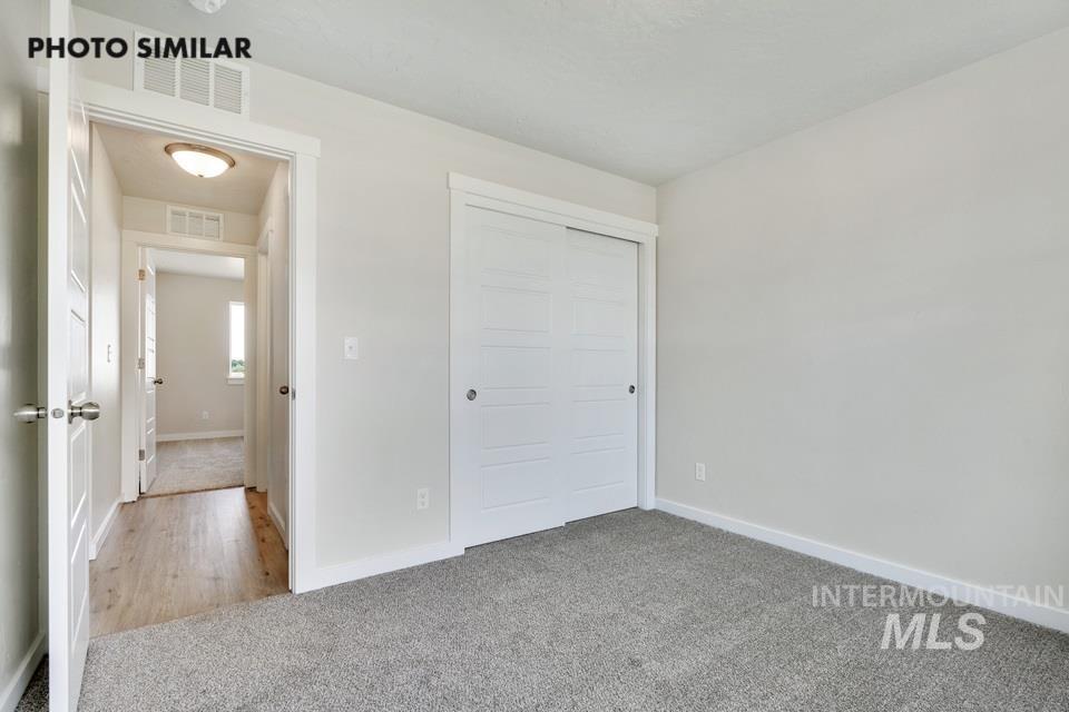 1652 Haystack Road Emmett, ID 83617 - Photo 24 of 29 Gray carpeted room featuring a white sliding closet door