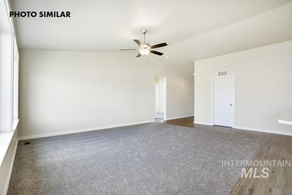 1652 Haystack Road Emmett, ID 83617 - Photo 5 of 29 Bright interior space featuring a vaulted ceiling and a ceiling fan with light fixture