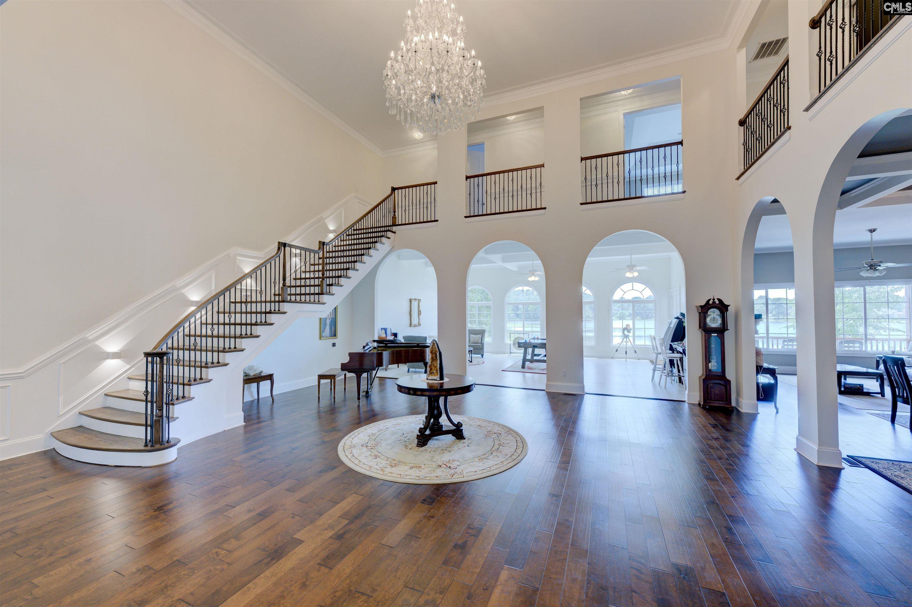 305 Northlake Road Columbia, SC 29223 - Photo 11 of 46 a view of a living room and chandelier with wooden floor