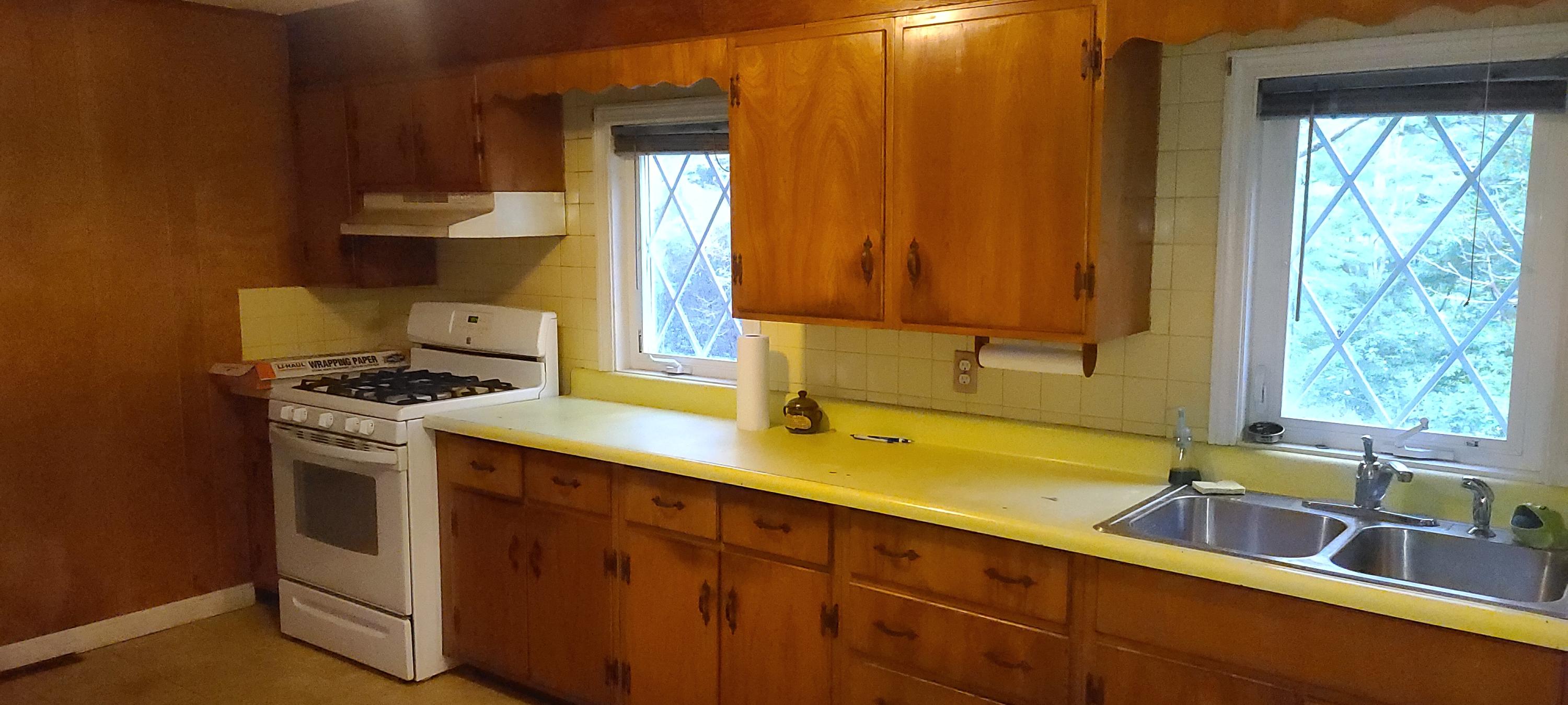 190 River Road Marstons Mills, MA 02648 - Photo 5 of 29 a kitchen with a sink and a stove next to a window