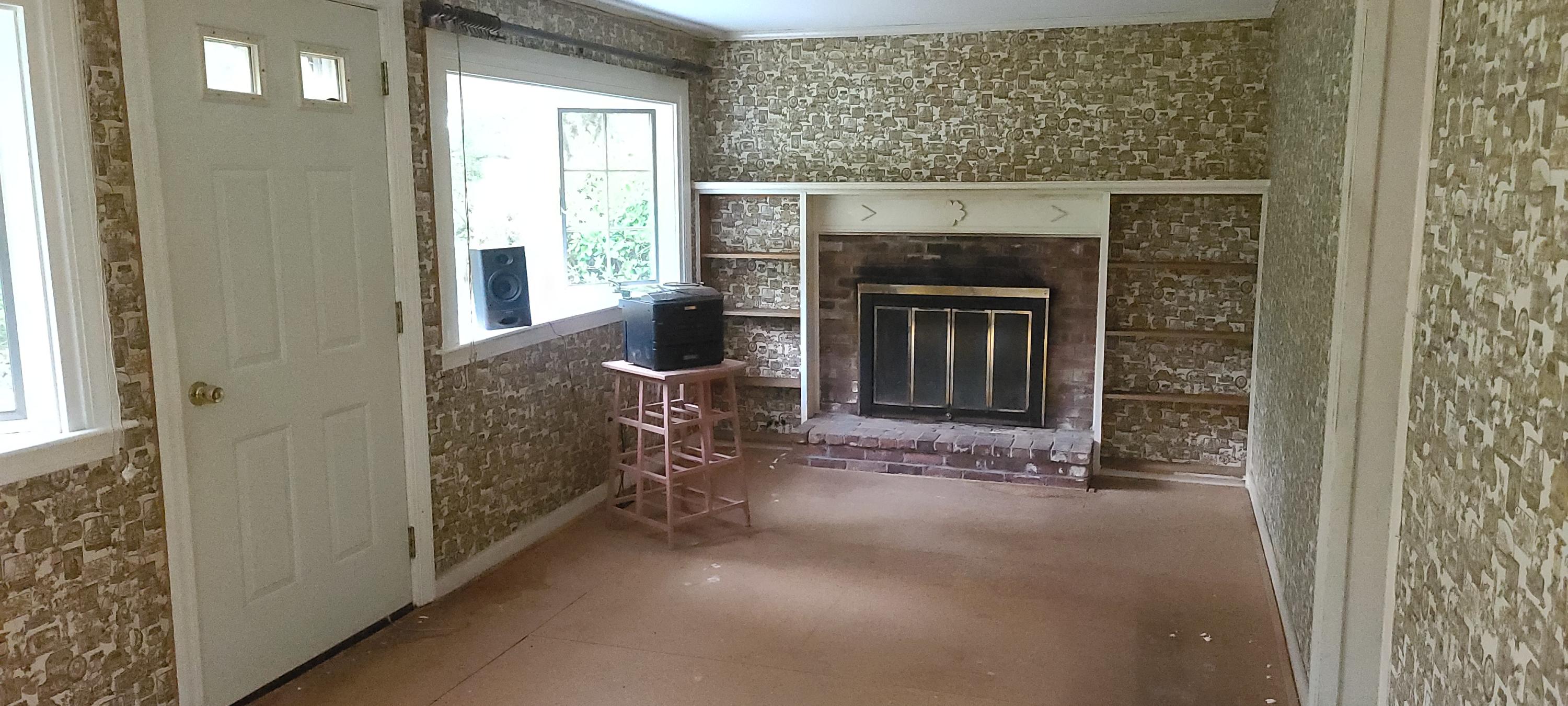 190 River Road Marstons Mills, MA 02648 - Photo 7 of 29 a view of an empty room with a fireplace and a window
