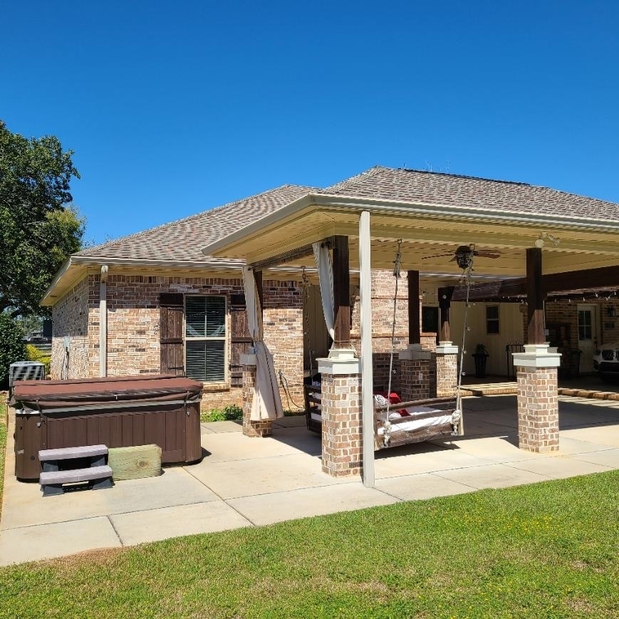 10051 Blackwell Nursery Road Semmes, AL 36575 - Photo 22 of 54 View of patio featuring a ceiling fan and a hot tub
