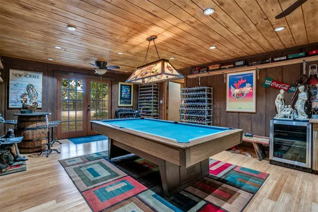 a bedroom with furniture and a chandelier
