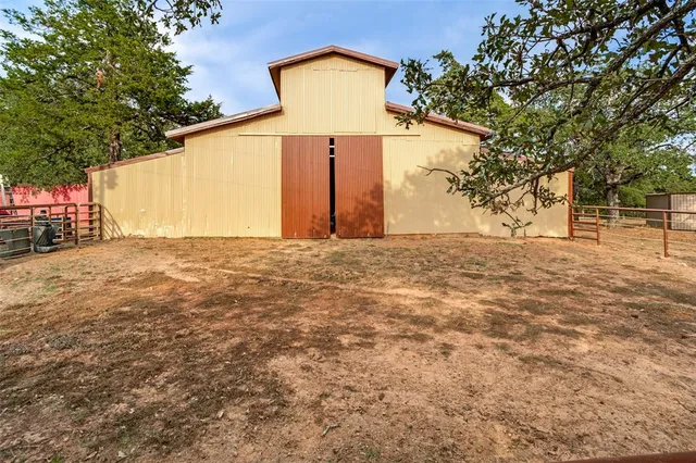 a view of a backyard of the house