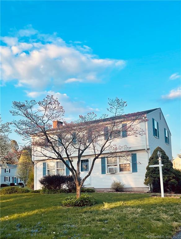 50 Buchanan Road Enfield, CT 06082 - Photo 1 of 1 a front view of house with yard and green space