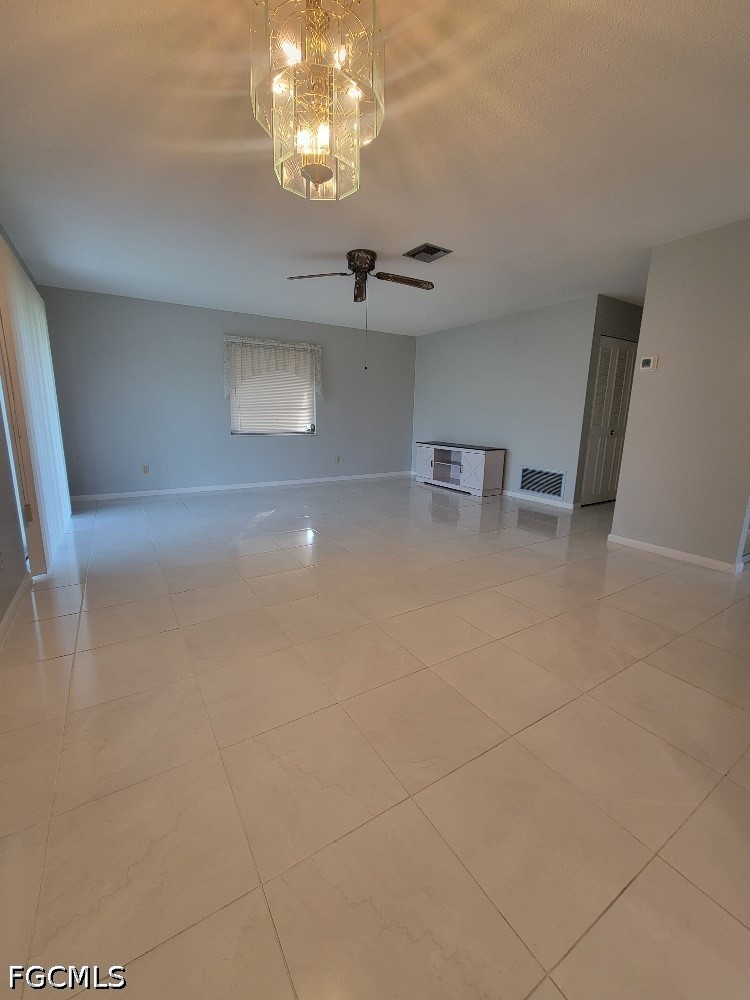 347 Richland Road Lehigh Acres, FL 33936 - Photo 6 of 16 a view of a livingroom with a fireplace
