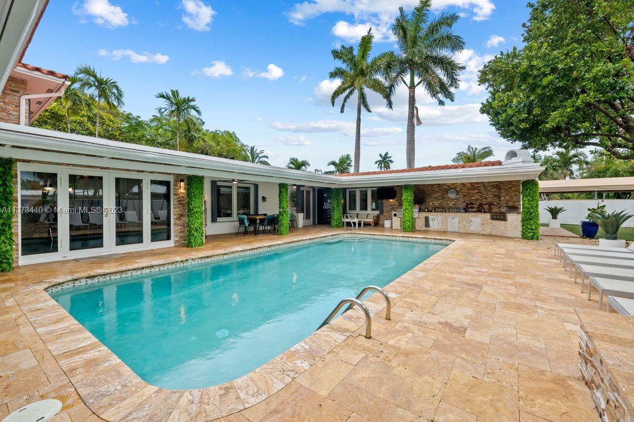 1401 South Ocean Drive Fort Lauderdale, FL 33316 - Photo 11 of 26 front view of a house with a swimming pool