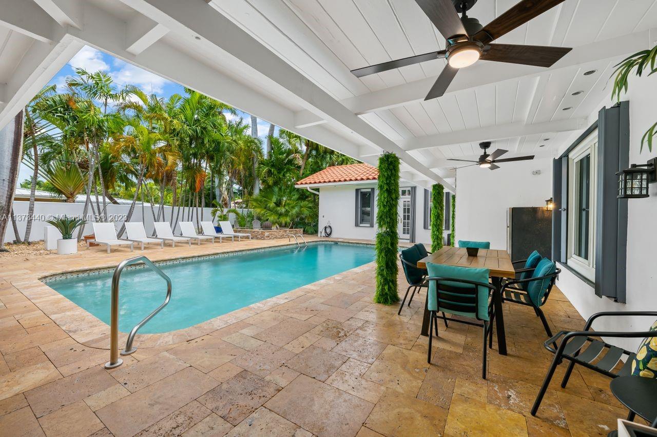 1401 South Ocean Drive Fort Lauderdale, FL 33316 - Photo 14 of 26 a view of a patio with table and chairs and potted plants