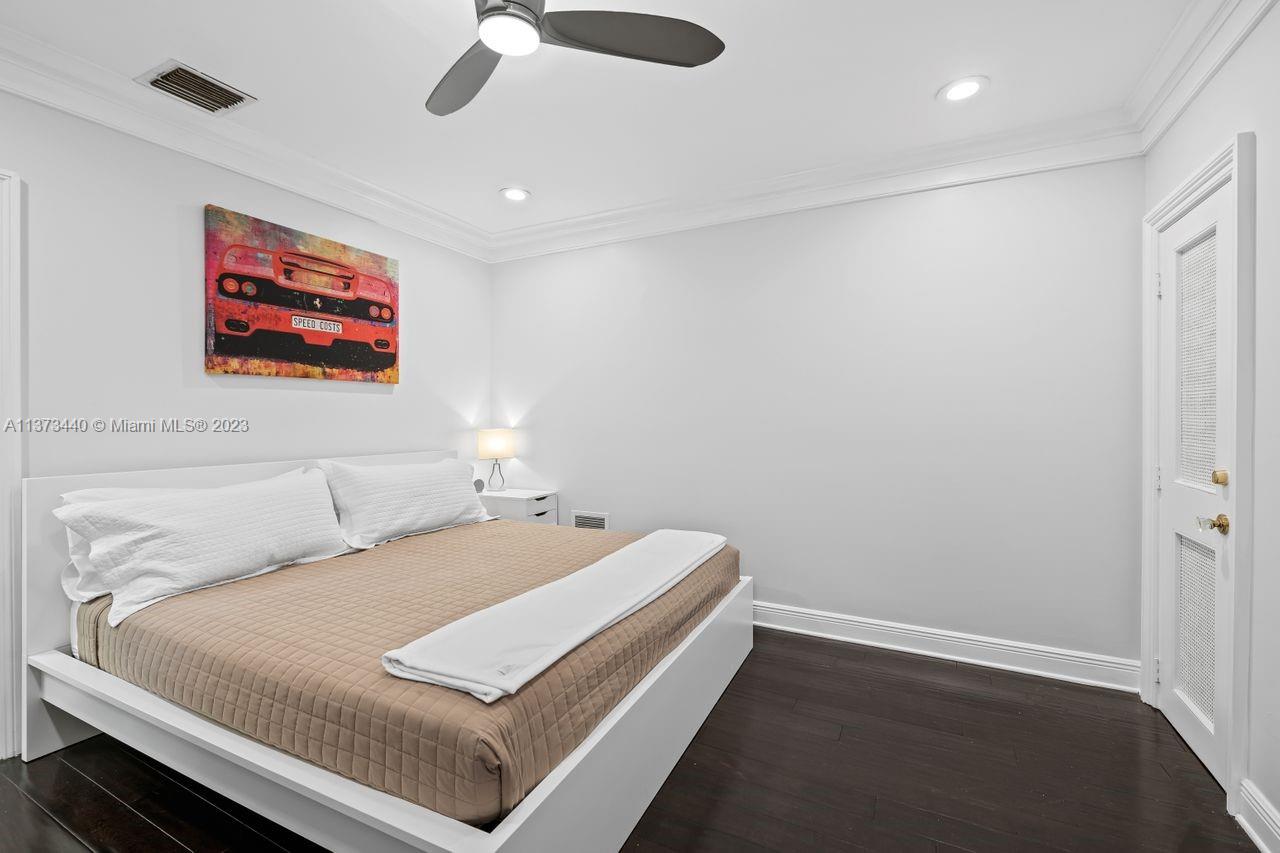 1401 South Ocean Drive Fort Lauderdale, FL 33316 - Photo 16 of 26 a bedroom with a bed and a painting on the wall