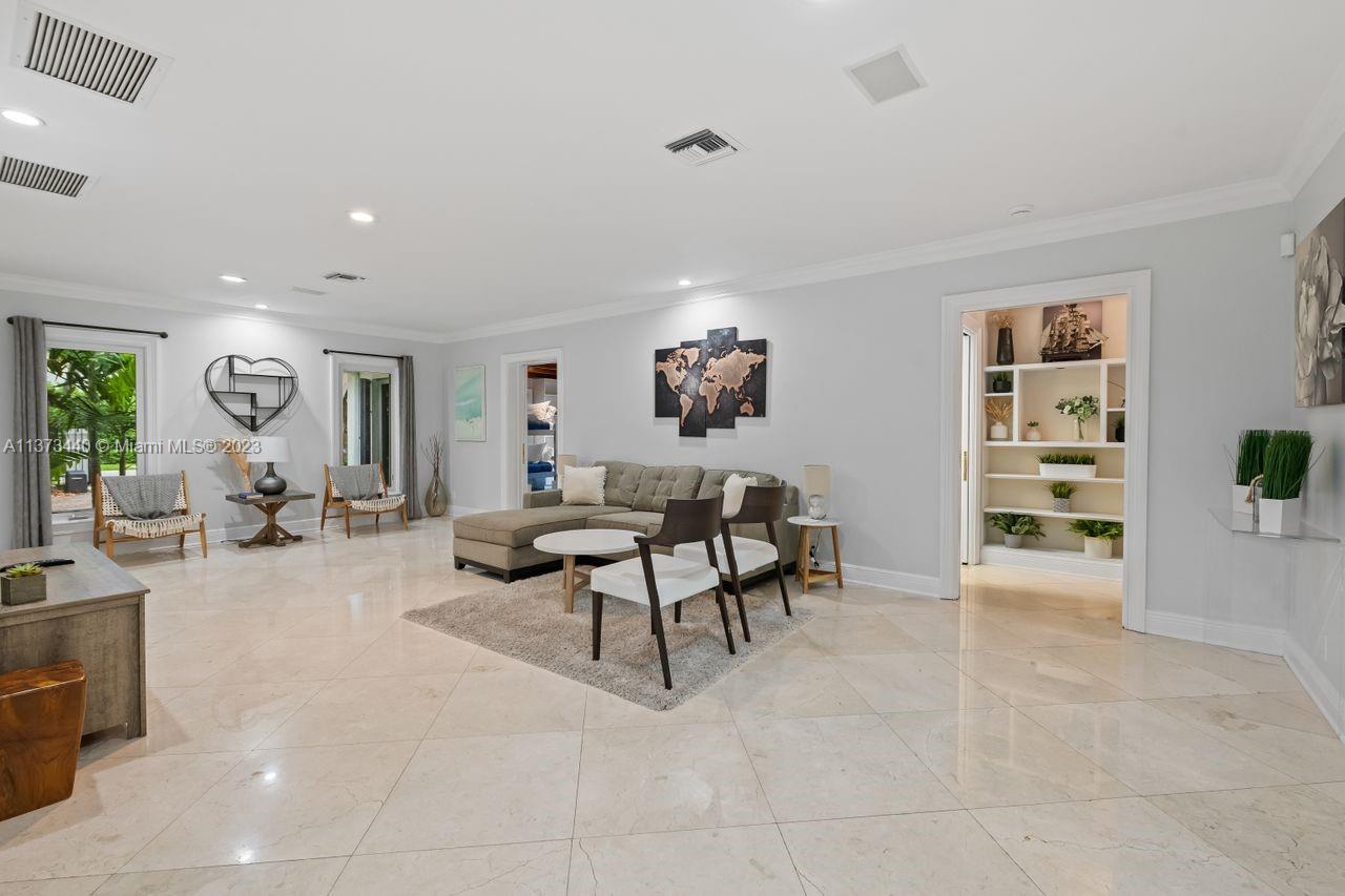1401 South Ocean Drive Fort Lauderdale, FL 33316 - Photo 17 of 26 a view of a livingroom with furniture and a window