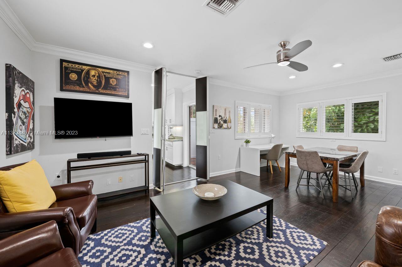 1401 South Ocean Drive Fort Lauderdale, FL 33316 - Photo 18 of 26 a living room with furniture and a flat screen tv