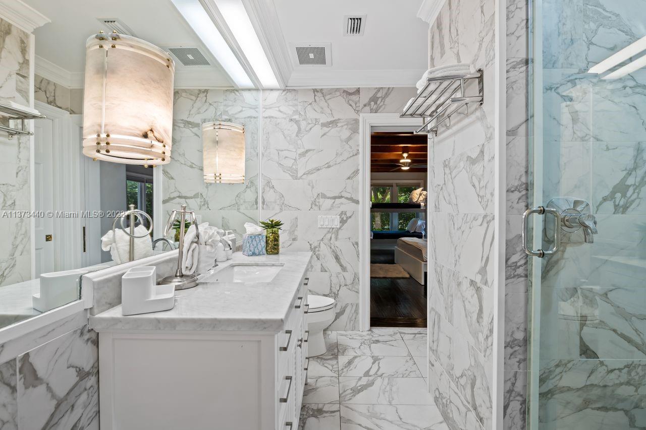 1401 South Ocean Drive Fort Lauderdale, FL 33316 - Photo 19 of 26 a bathroom with a sink and a mirror