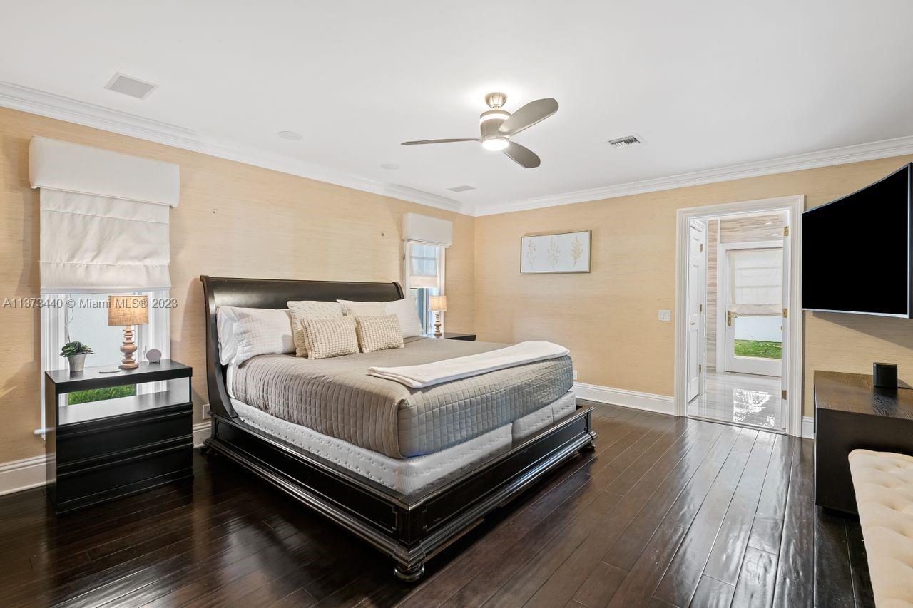 1401 South Ocean Drive Fort Lauderdale, FL 33316 - Photo 21 of 26 a bedroom with a bed and a flat screen tv