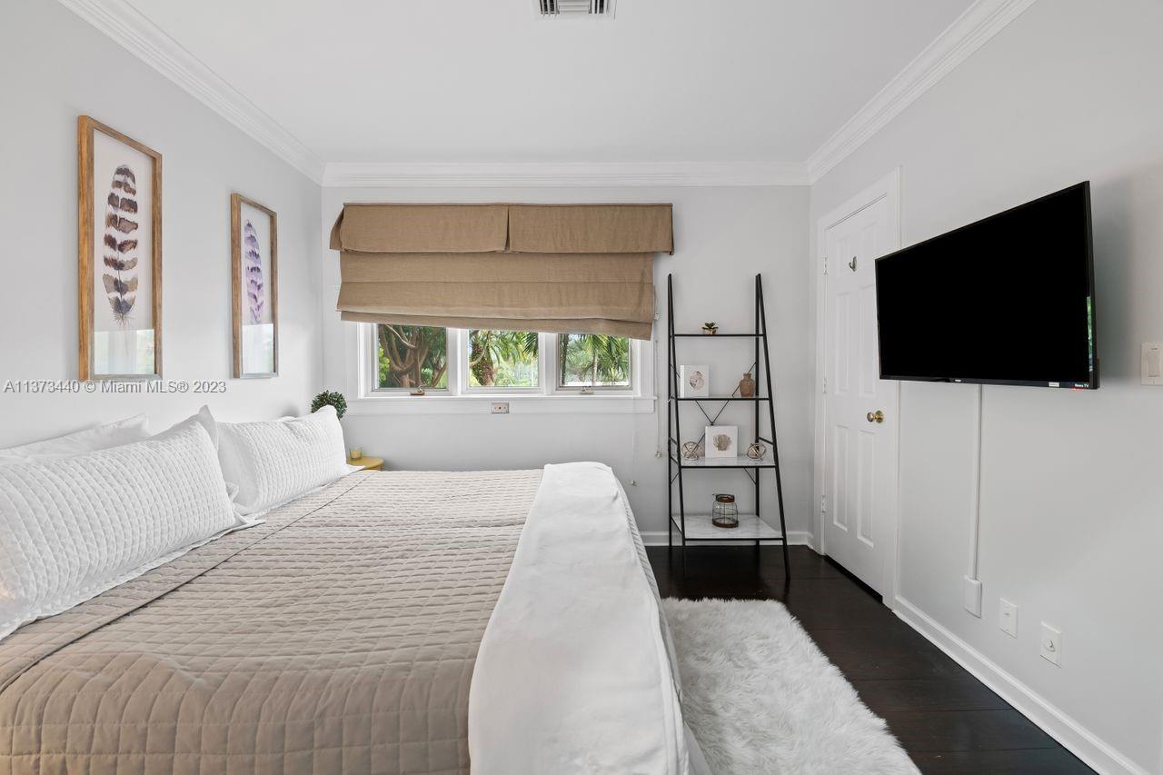 1401 South Ocean Drive Fort Lauderdale, FL 33316 - Photo 26 of 26 a bedroom with a bed tv and window