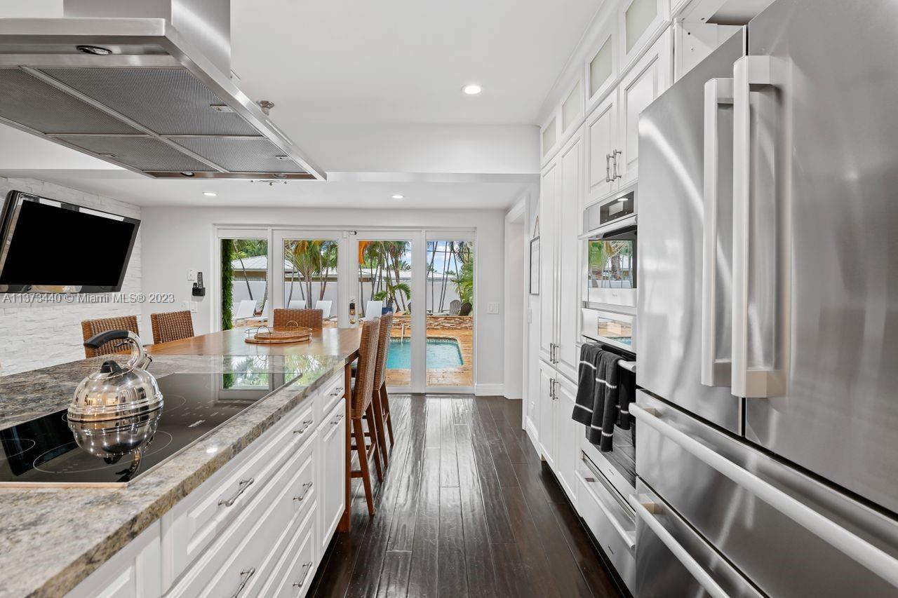 1401 South Ocean Drive Fort Lauderdale, FL 33316 - Photo 3 of 26 a very nice looking room with wooden floor and furniture