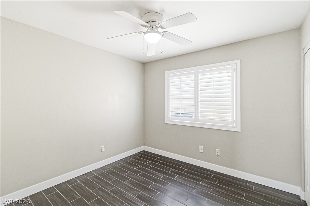 9523 Observer Street Las Vegas, NV 89123 - Photo 21 of 42 Well-appointed bedroom featuring a ceiling fan and elegant plantation shutters.
