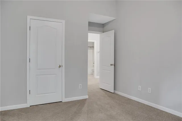 an empty room with closet area