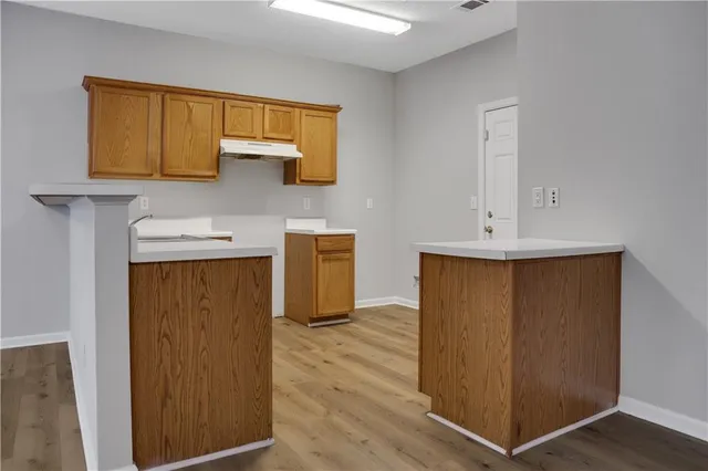 a view of front door with wooden floor