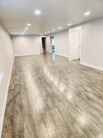 36 West Syracuse Road Vineyard, UT 84059 - Photo 51 of 56 Expansive interior space featuring wood-finish flooring, recessed lighting, and light-toned wall finishes