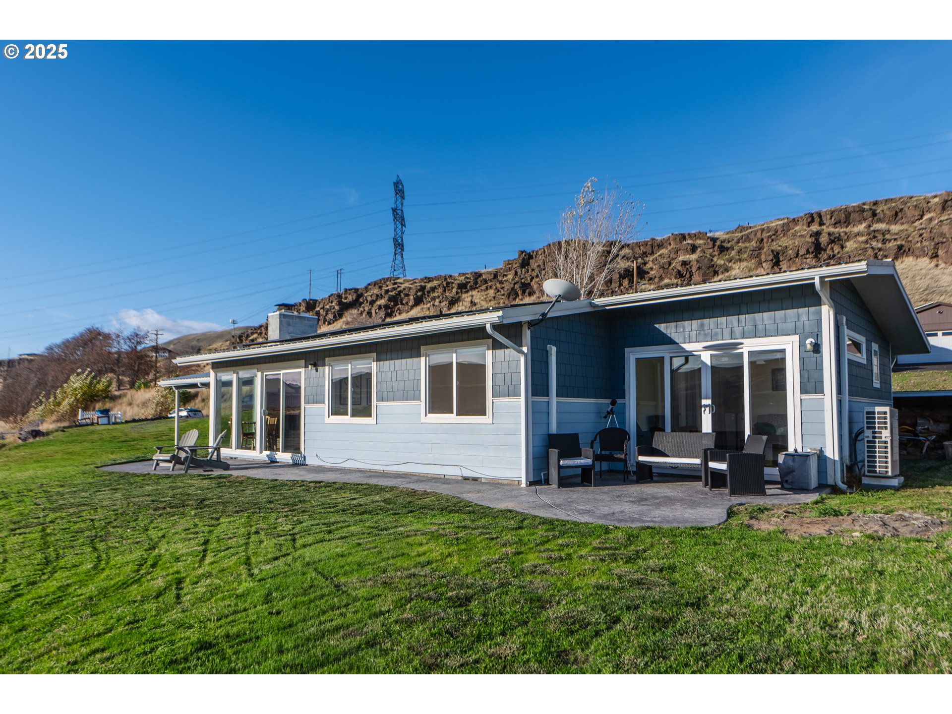 350 Bluff Road Wishram, WA 98673 - Photo 1 of 36 a front view of a house with a garden