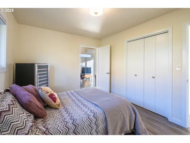 a bedroom with a bed and a closet