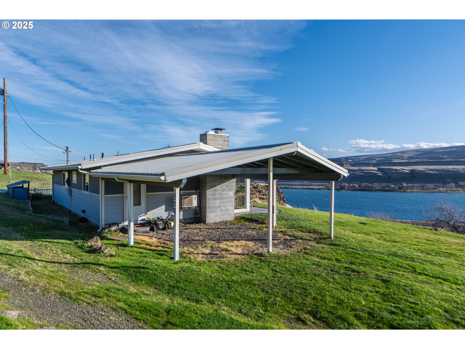 350 Bluff Road Wishram, WA 98673 - Photo 3 of 36 a backyard of a house with table and chairs