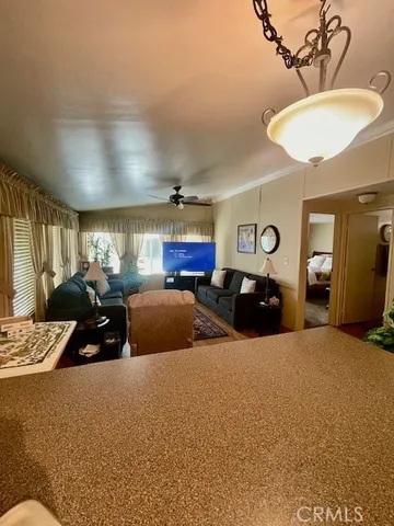 a bed room with two bed and a chair