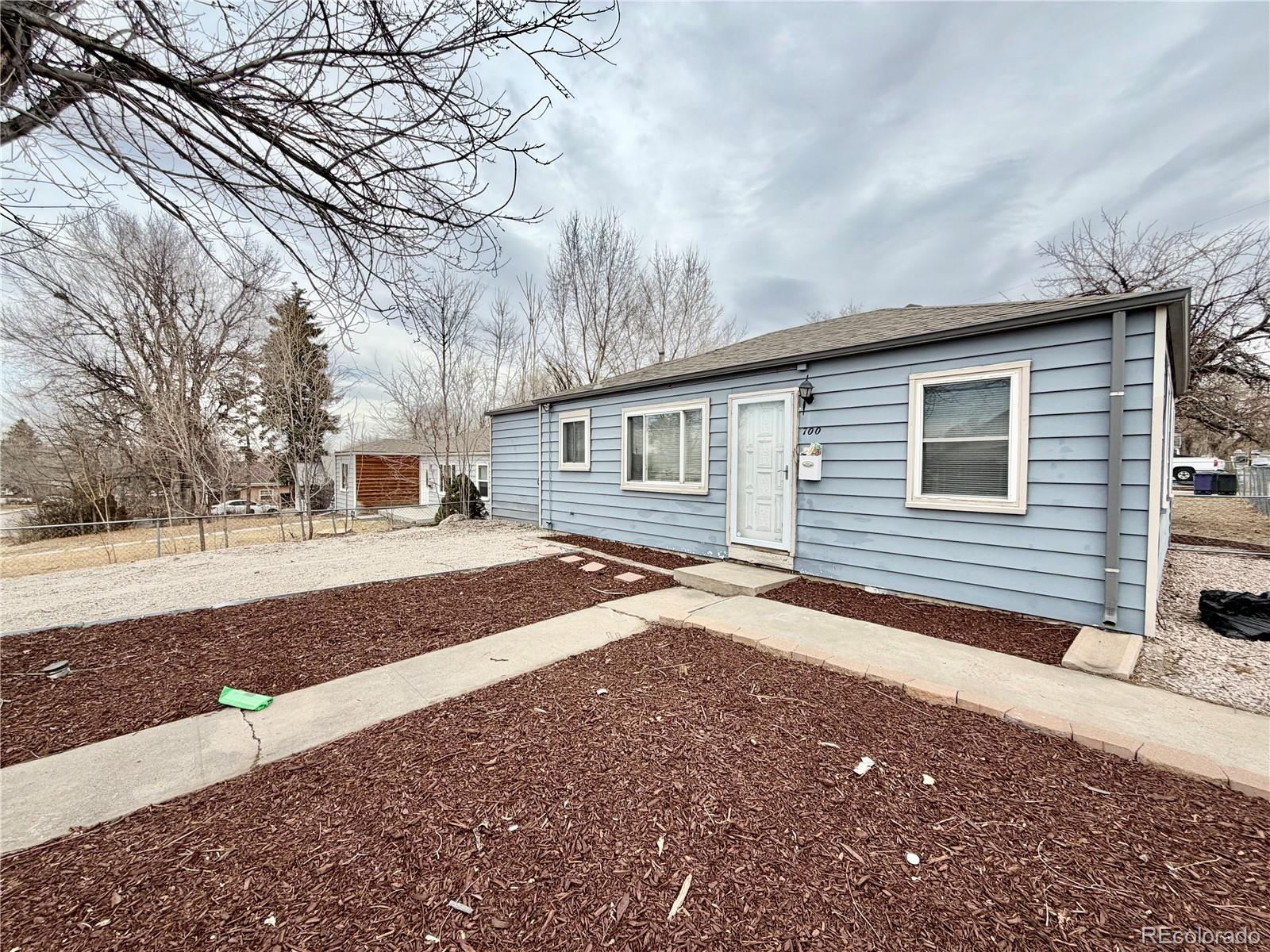 700 Perry Street Denver, CO 80204 - Photo 2 of 16 a backyard of a house with large trees
