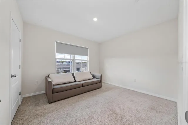 a view of empty room with closet and utility